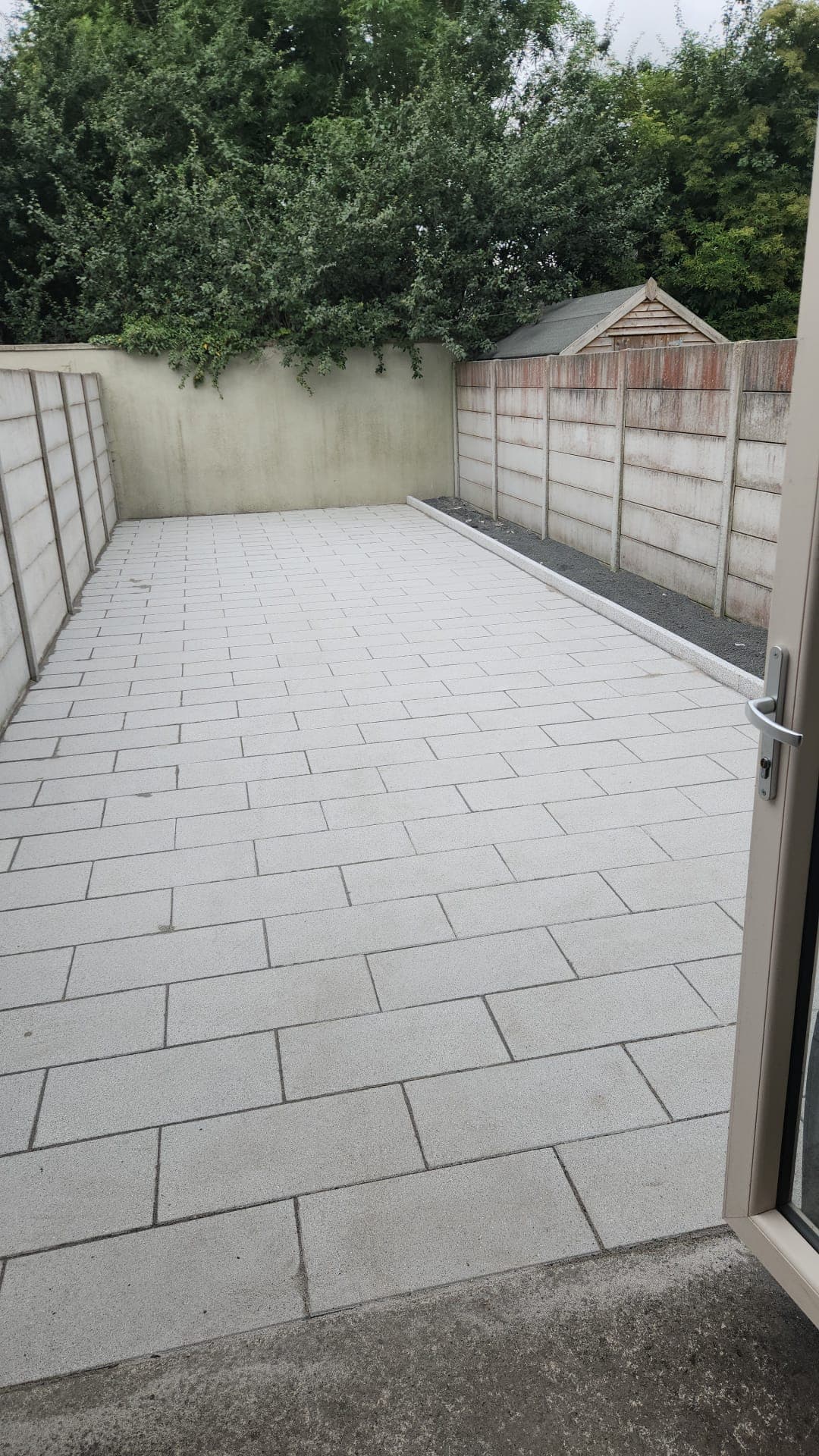 View from the patio doors across the finished paving