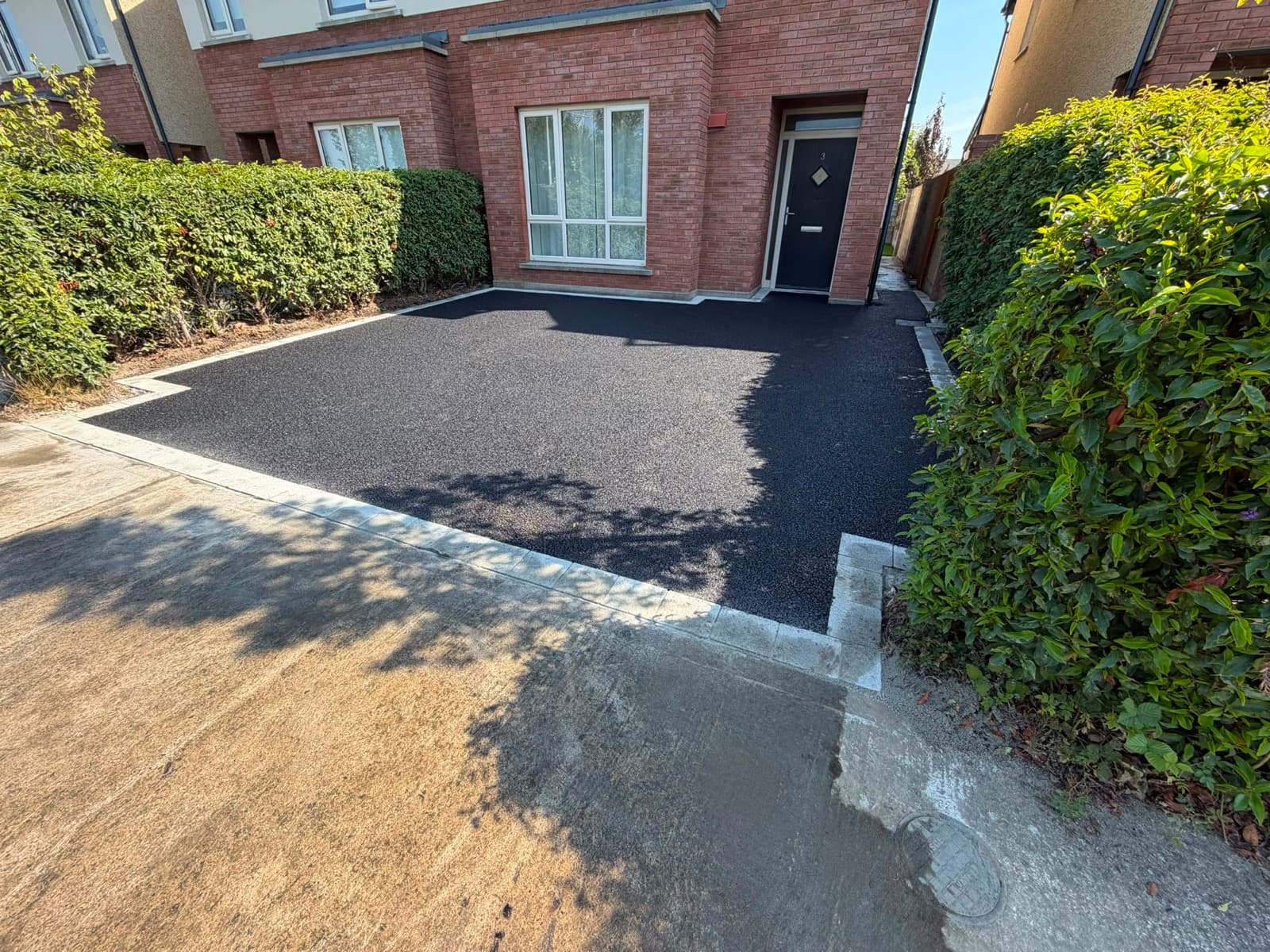 Completed tarmac driveway, front of house